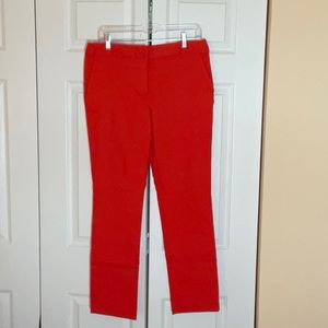 Orange rayon spandex stretch pants.